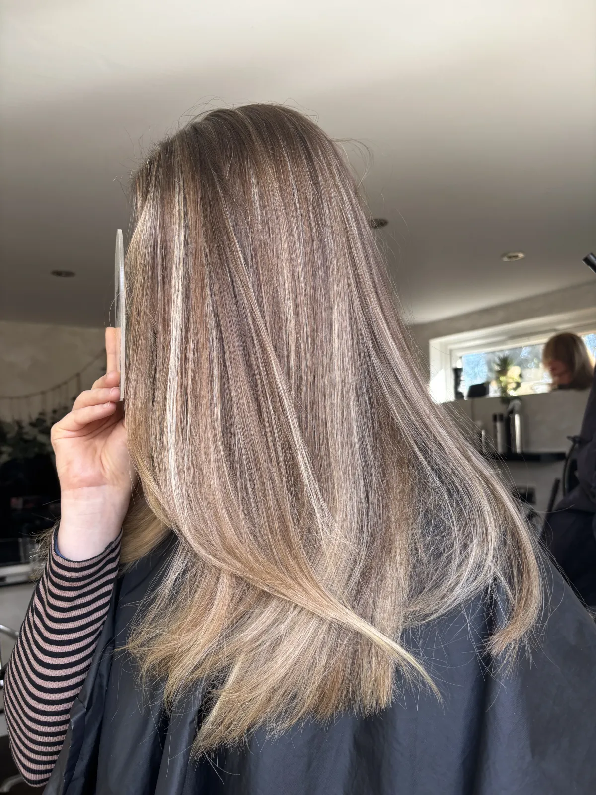 Gloss and toner result — cool, polished blonde at MNR Hair