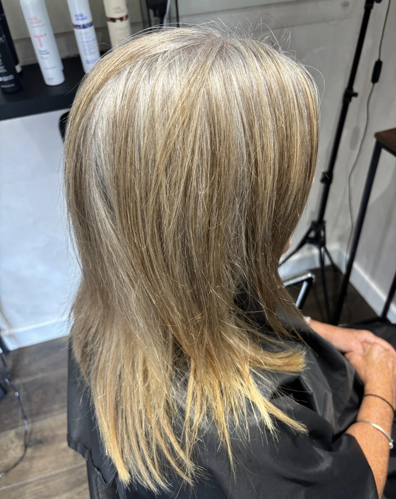 Before grey blending with warm, uneven blonde colour and visible regrowth