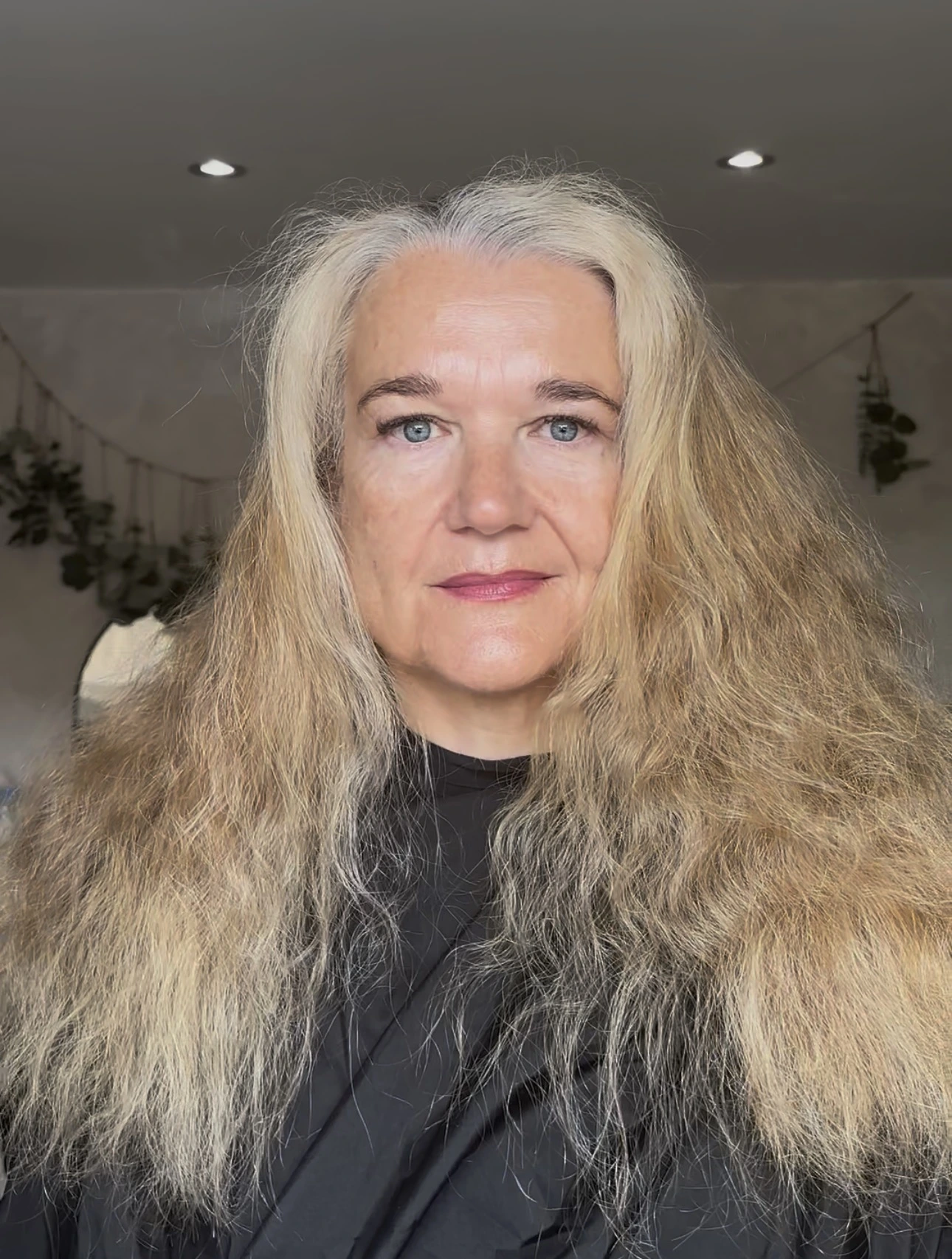 Before grey blending with long, textured blonde hair and visible natural silver