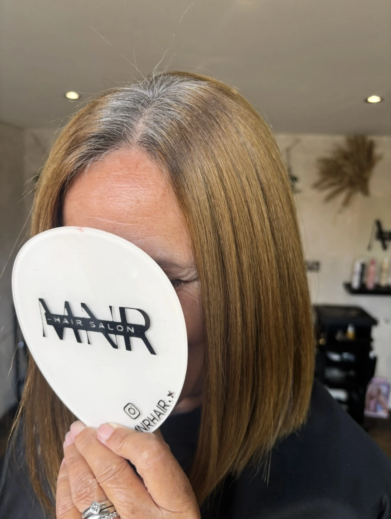 Before grey blending with visible silver regrowth and warm brunette lengths