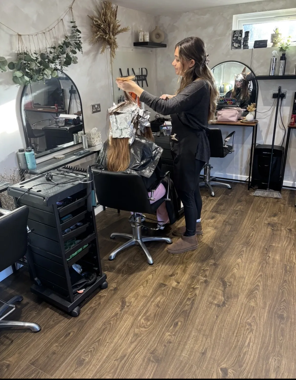 Stylist applying foils during a balayage consultation at MNR Hair, Quedgeley
